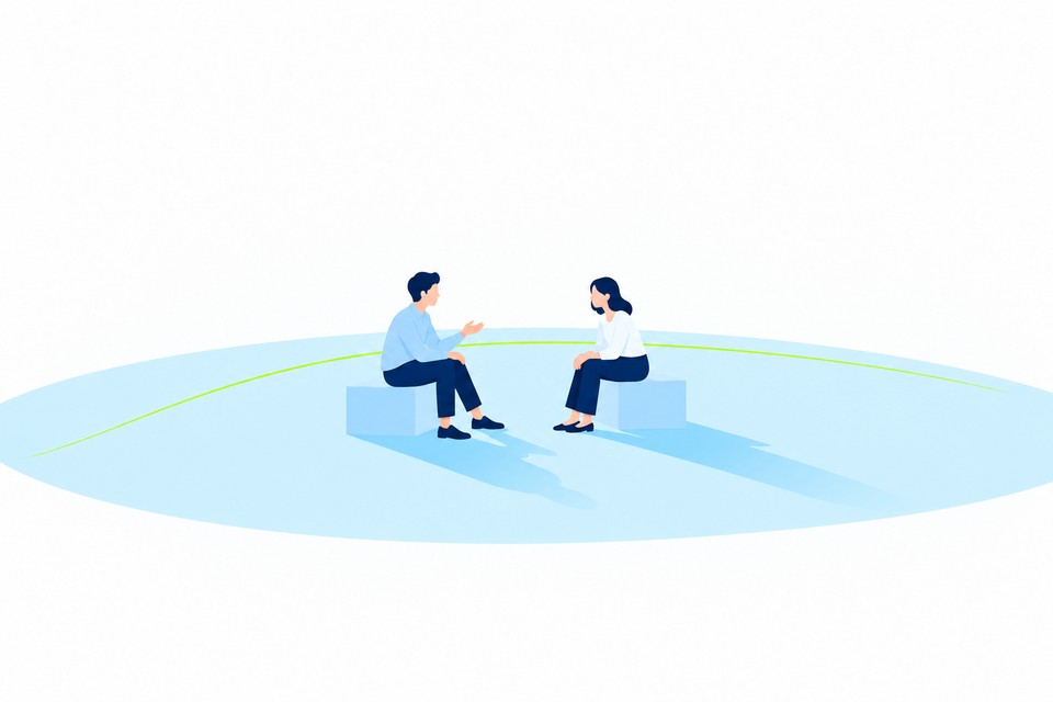 向かい合って座り、話を聞き合う二人